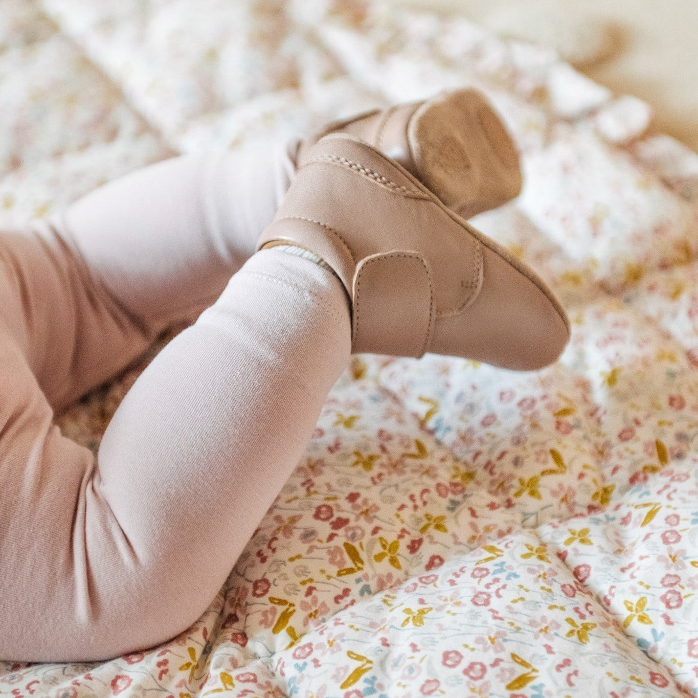 Floral Play Mat with baby's legs shown overtop